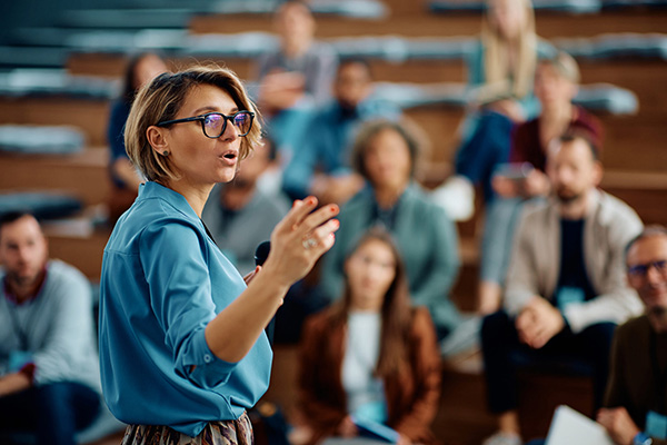 A woman speaking to an audience