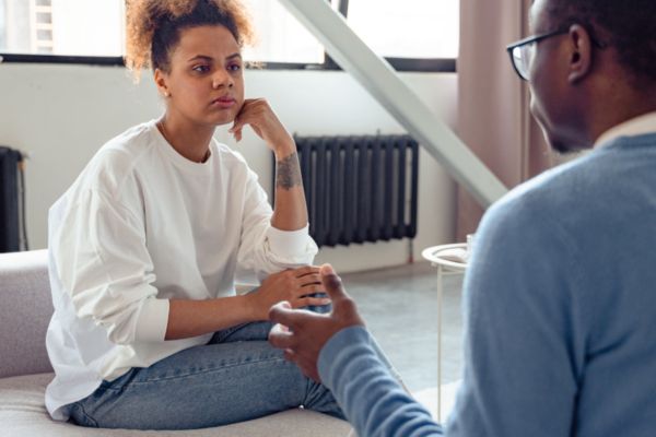 Woman listening patiently to a man speaking.