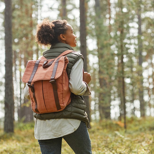 A young woman backpacking